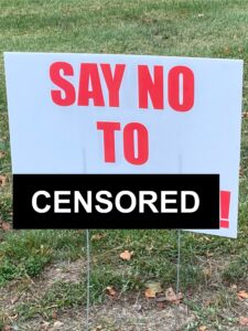 A political sign that reads "say no to censored!"